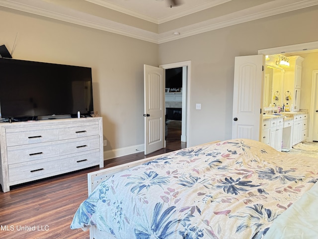 128 Charlton Dr, Madison, MS 39110 - bedroom featuring dark wood-style flooring, crown molding, connected bathroom, and baseboards