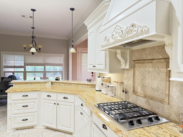 128 Charlton Dr, Madison, MS 39110 - kitchen featuring stainless steel gas cooktop, custom range hood, decorative backsplash, a peninsula, and white cabinetry