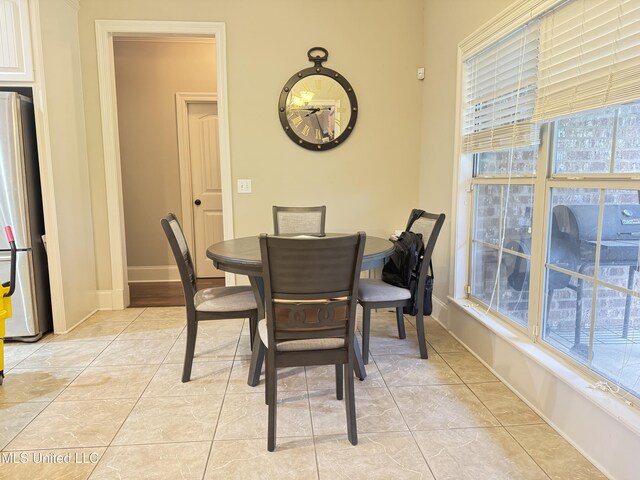 128 Charlton Dr, Madison, MS 39110 - dining area featuring light tile patterned flooring and baseboards
