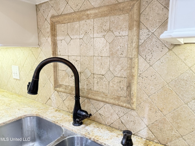 128 Charlton Dr, Madison, MS 39110 - kitchen view of backsplash, a sink, and light stone countertops