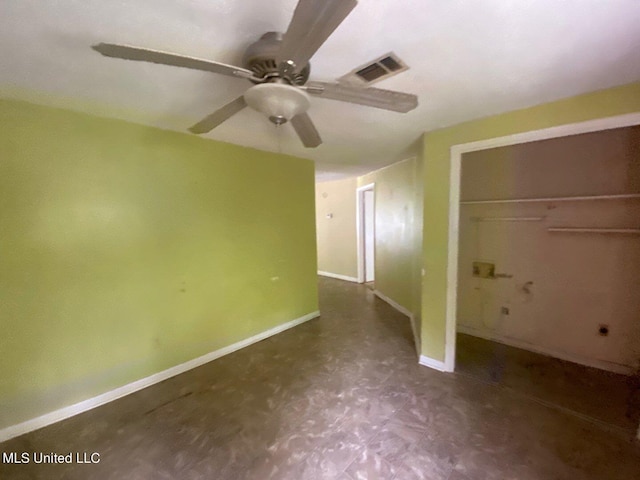 unfurnished bedroom featuring tile patterned floors, baseboards, visible vents, a closet, and ceiling fan
