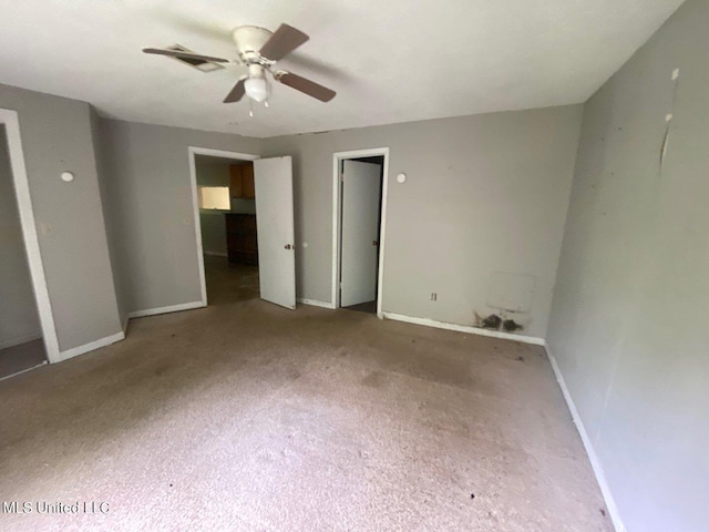 unfurnished bedroom featuring visible vents, a ceiling fan, and baseboards
