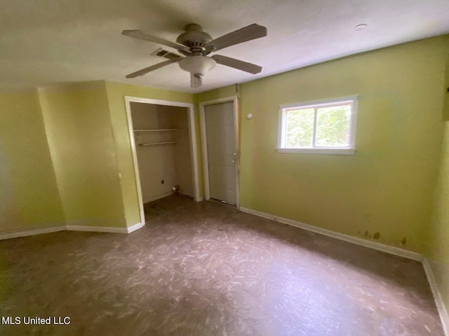 unfurnished bedroom with visible vents, a ceiling fan, and baseboards