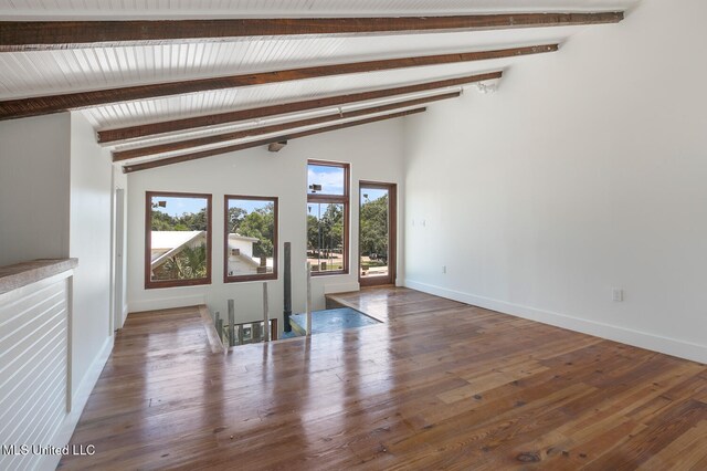 301 S Toulme St Unit 201, Bay Saint Louis, MS 39520 - spare room with vaulted ceiling with beams and hardwood / wood-style floors