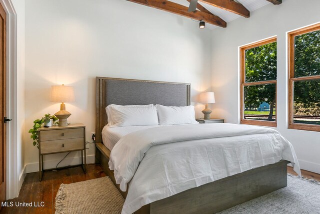 301 S Toulme St Unit 201, Bay Saint Louis, MS 39520 - bedroom featuring lofted ceiling with beams, dark hardwood / wood-style floors, and ceiling fan
