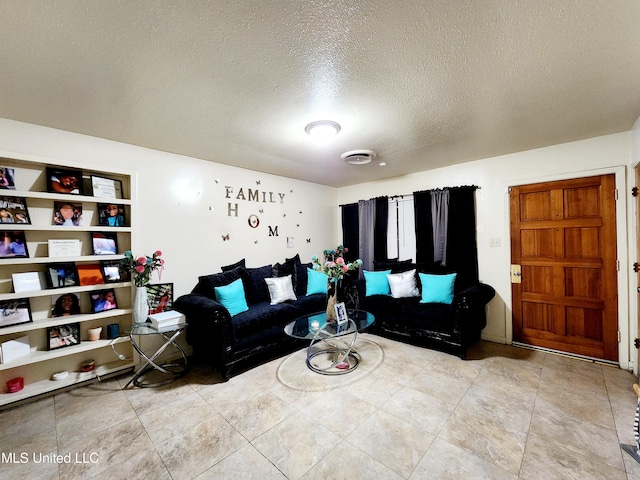 living room with a textured ceiling