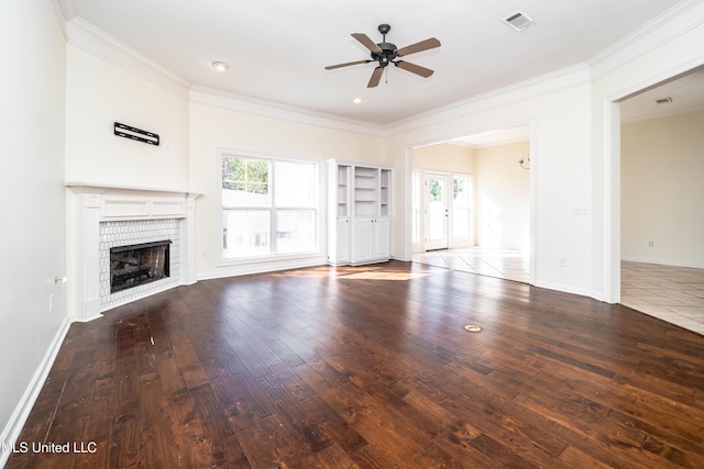 unfurnished living room featuring hardwood / wood-style floors, a fireplace, and ceiling fan