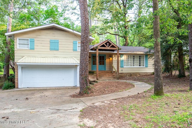 1777 Brecon Dr, Jackson, MS 39211 - split level home featuring concrete driveway and a garage