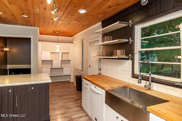 1777 Brecon Dr, Jackson, MS 39211 - kitchen with wooden counters, a sink, dishwasher, crown molding, and backsplash