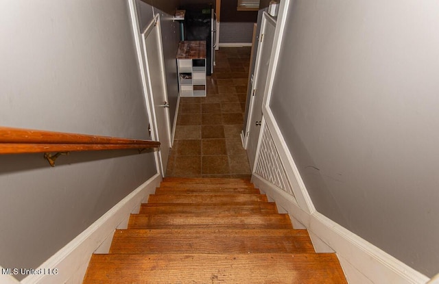 1777 Brecon Dr, Jackson, MS 39211 - staircase featuring tile patterned flooring and baseboards