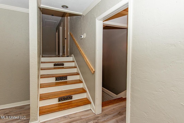 1777 Brecon Dr, Jackson, MS 39211 - staircase with wood finished floors, a textured wall, attic access, crown molding, and baseboards