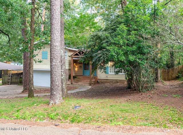 1777 Brecon Dr, Jackson, MS 39211 - view of property hidden behind natural elements with an attached garage