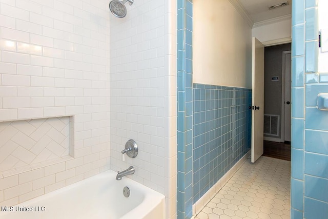 1777 Brecon Dr, Jackson, MS 39211 - bathroom with ornamental molding, tile walls,  shower combination, and tile patterned flooring