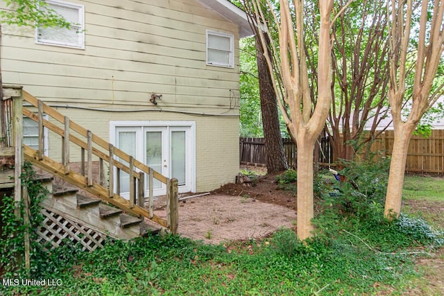 1777 Brecon Dr, Jackson, MS 39211 - back of house featuring a fenced backyard and brick siding