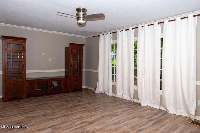1777 Brecon Dr, Jackson, MS 39211 - empty room featuring wood finished floors, baseboards, a ceiling fan, and ornamental molding
