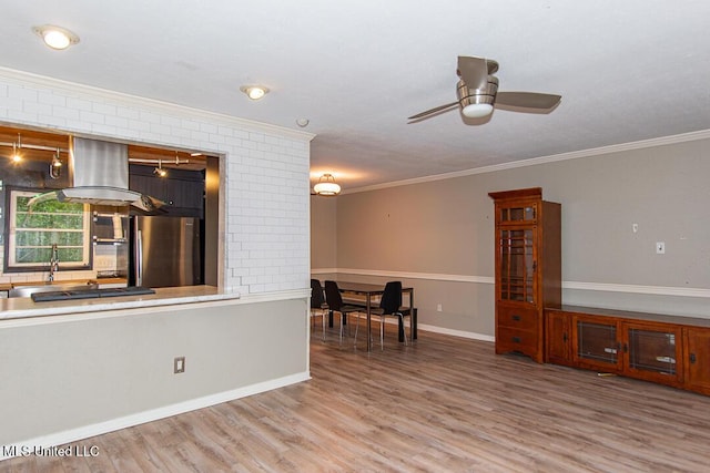 1777 Brecon Dr, Jackson, MS 39211 - kitchen featuring freestanding refrigerator, ornamental molding, wood finished floors, a ceiling fan, and baseboards