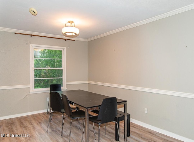 1777 Brecon Dr, Jackson, MS 39211 - dining area featuring wood finished floors, baseboards, and crown molding