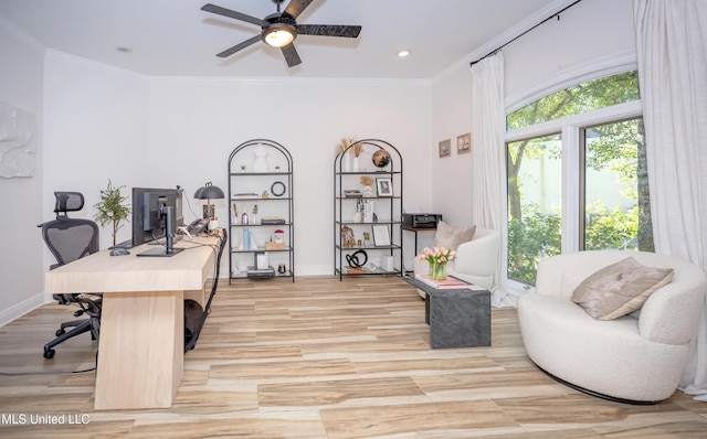 home office featuring a ceiling fan, recessed lighting, baseboards, crown molding, and light wood-type flooring