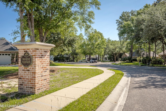 view of community featuring a lawn