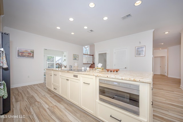kitchen with crown molding, visible vents, stainless steel microwave, and recessed lighting