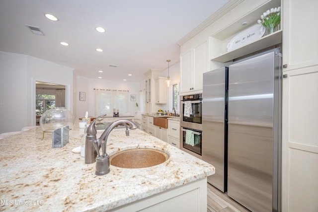 kitchen featuring a sink, open shelves, visible vents, white cabinets, and appliances with stainless steel finishes