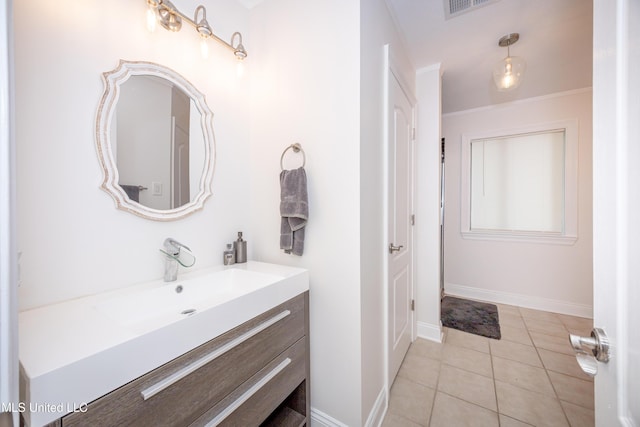 bathroom featuring baseboards, tile patterned flooring, vanity, and visible vents