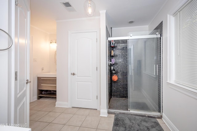 full bathroom with a shower stall, crown molding, tile patterned floors, and visible vents