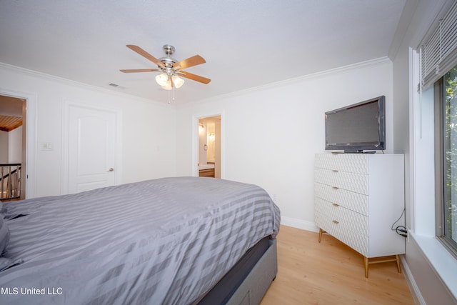 bedroom with light wood-style flooring, a ceiling fan, crown molding, visible vents, and baseboards