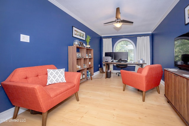 office space featuring baseboards, ornamental molding, light wood finished floors, and ceiling fan