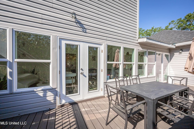 wooden deck with outdoor dining space