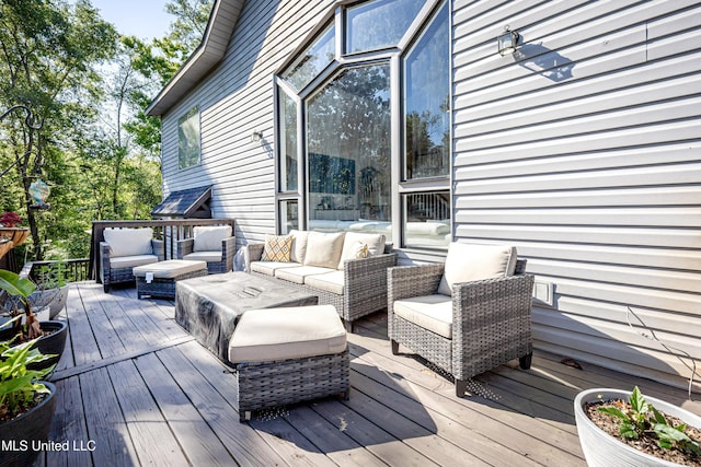 wooden deck featuring an outdoor hangout area