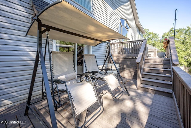 wooden terrace featuring stairway
