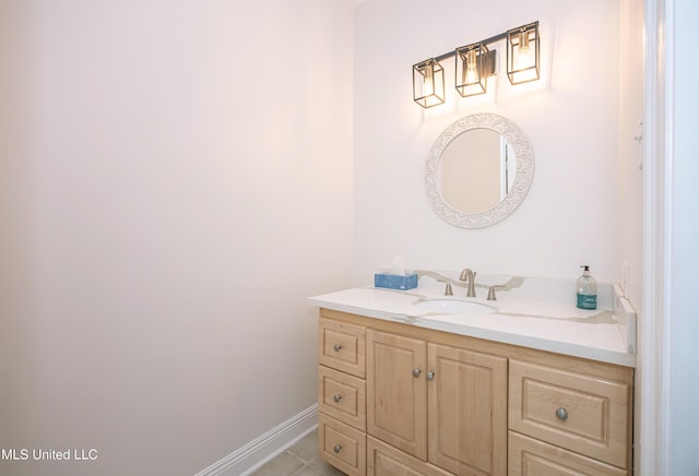 bathroom with vanity and baseboards