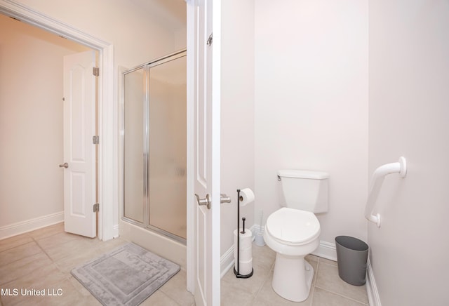 full bathroom with toilet, baseboards, tile patterned flooring, and a stall shower