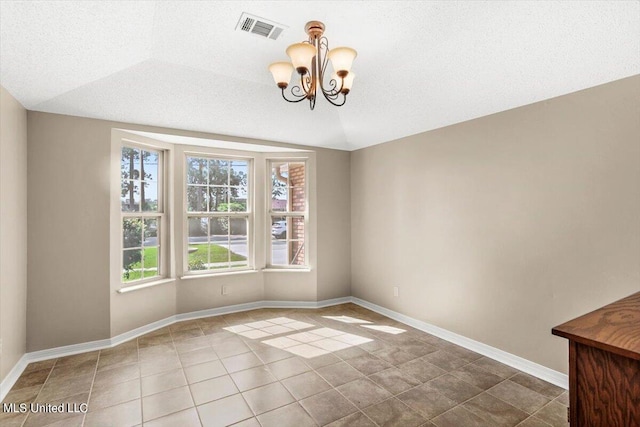 unfurnished dining area featuring tile patterned flooring, a textured ceiling, vaulted ceiling, and a chandelier