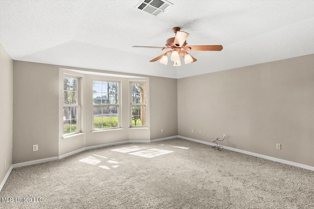 unfurnished room featuring ceiling fan, carpet flooring, a textured ceiling, and vaulted ceiling