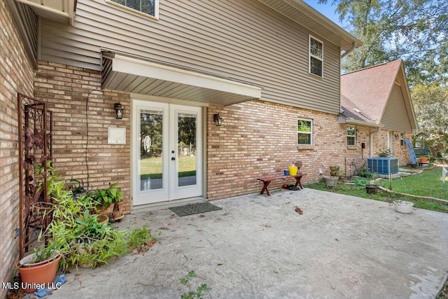 rear view of property featuring a patio area, french doors, and central AC unit