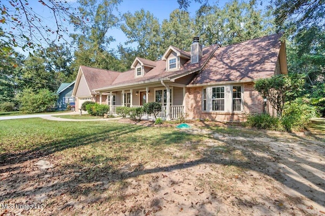 cape cod-style house featuring a porch and a front lawn