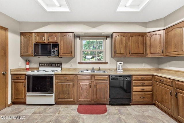 kitchen with black appliances and sink