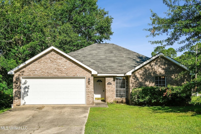 view of front facade with a front lawn and a garage