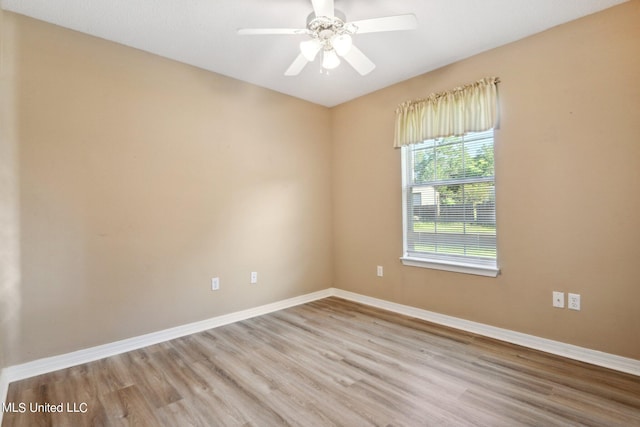 empty room with light hardwood / wood-style floors and ceiling fan