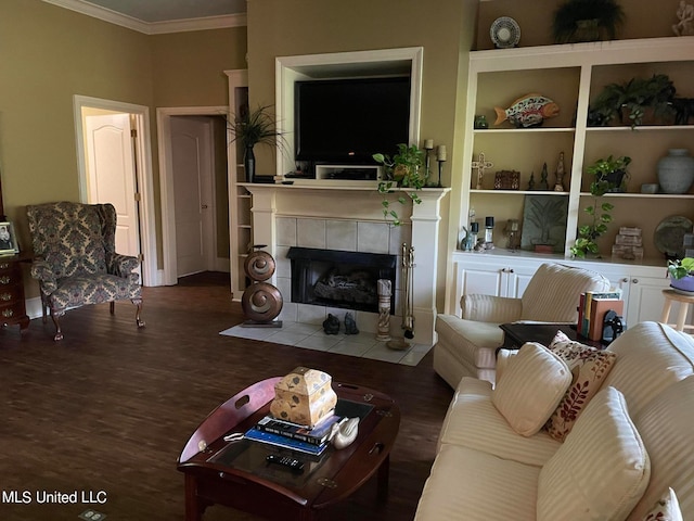 living room with ornamental molding, a fireplace, and dark hardwood / wood-style flooring