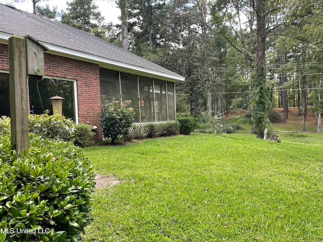 view of yard featuring a sunroom