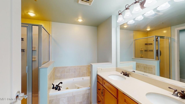 bathroom featuring a tub with jets, a sink, visible vents, and a shower stall