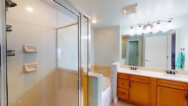 full bathroom featuring a garden tub, a sink, and a shower stall