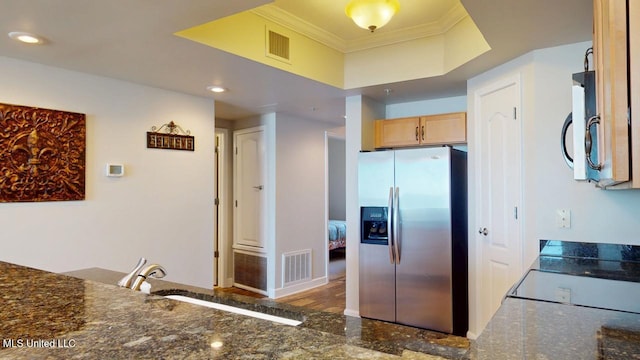 kitchen featuring stainless steel appliances, visible vents, crown molding, and granite finish floor