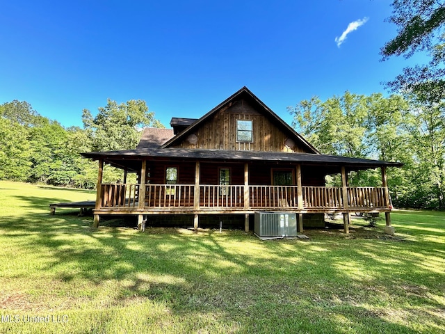 31019 N 19th Hwy, West, MS 39192 - rear view of property featuring a yard, cooling unit, covered porch, and log siding
