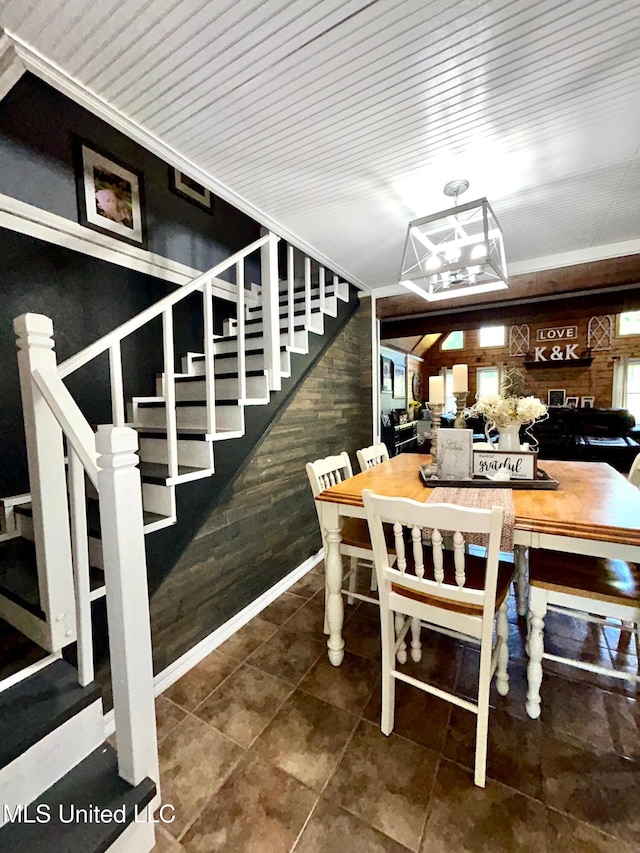 31019 N 19th Hwy, West, MS 39192 - dining room featuring a chandelier, wooden walls, and stairs
