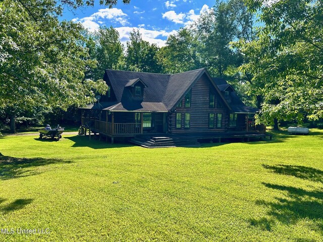 31019 N 19th Hwy, West, MS 39192 - view of front facade featuring a deck, a front lawn, and log exterior
