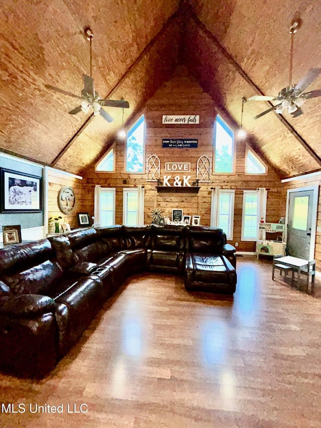 31019 N 19th Hwy, West, MS 39192 - living room featuring wood walls, wood finished floors, a ceiling fan, and high vaulted ceiling